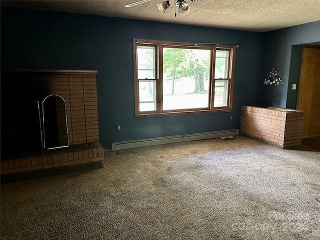 unfurnished living room with carpet floors, a baseboard radiator, a textured ceiling, a fireplace, and ceiling fan