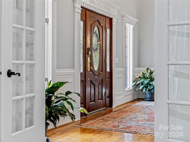 entryway with wood-type flooring