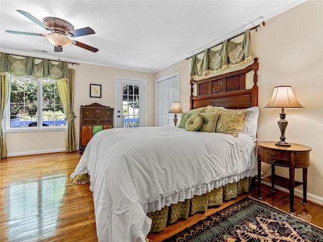 bedroom featuring crown molding, access to outside, hardwood / wood-style floors, and ceiling fan