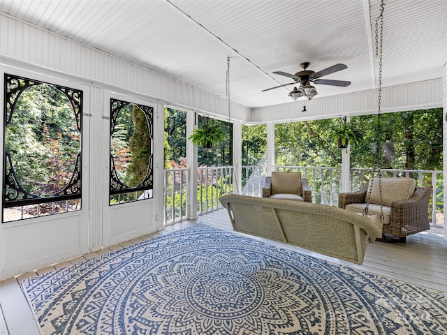 sunroom with ceiling fan and a healthy amount of sunlight