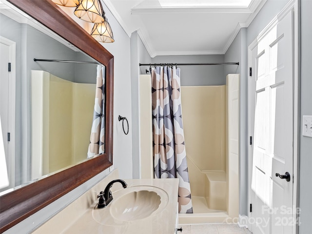 bathroom featuring tile patterned floors, vanity, crown molding, and curtained shower