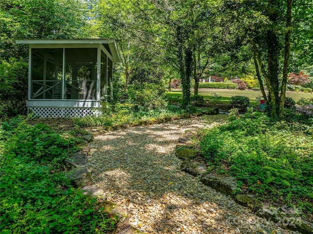 view of yard with a sunroom