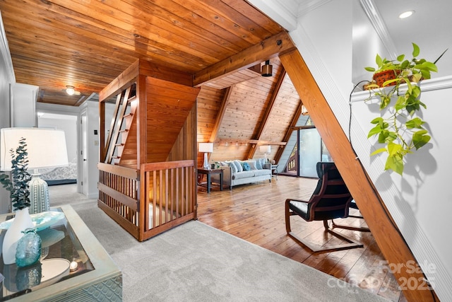 additional living space featuring beamed ceiling, light hardwood / wood-style floors, a healthy amount of sunlight, and wood ceiling