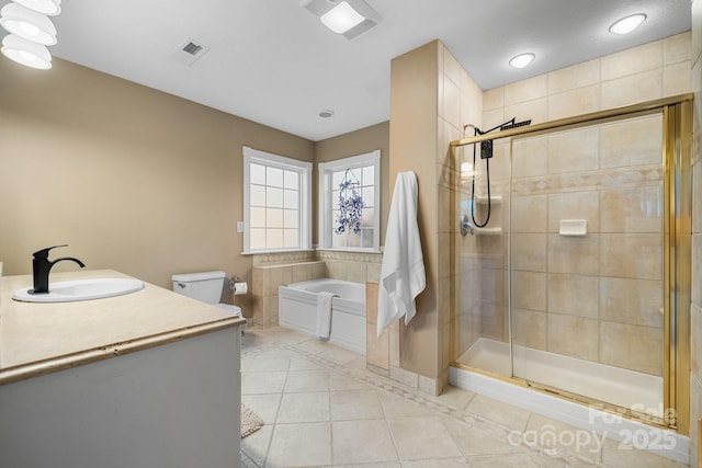 full bathroom featuring tile patterned flooring, vanity, toilet, and plus walk in shower