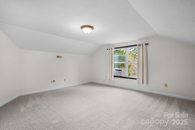 additional living space featuring carpet flooring, cooling unit, and lofted ceiling