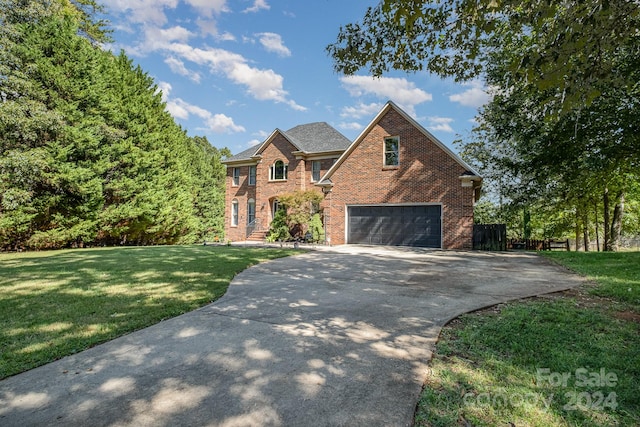 front of property featuring a garage and a front yard