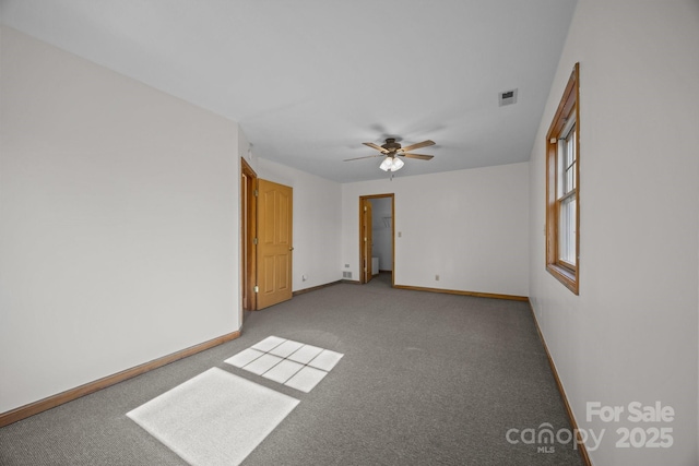 unfurnished room featuring carpet and ceiling fan