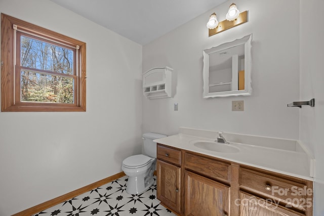 bathroom featuring toilet and vanity