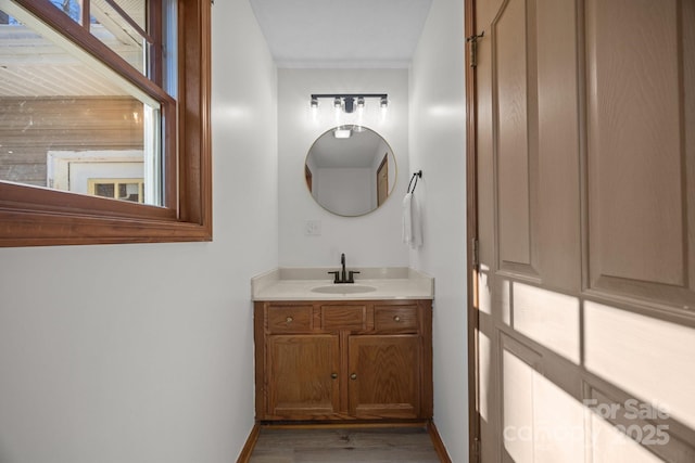 bathroom with vanity and hardwood / wood-style flooring