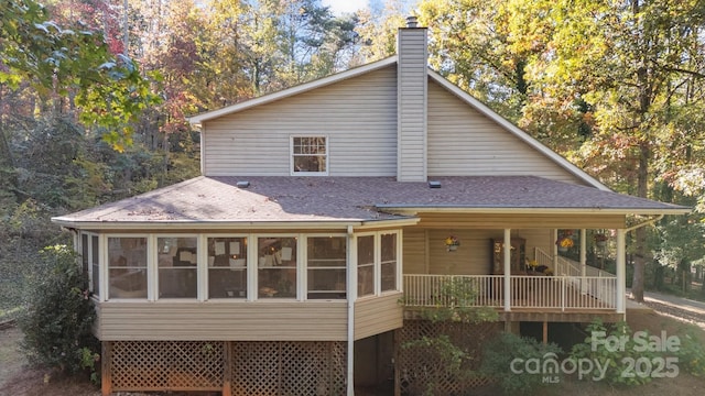 back of house with a sunroom