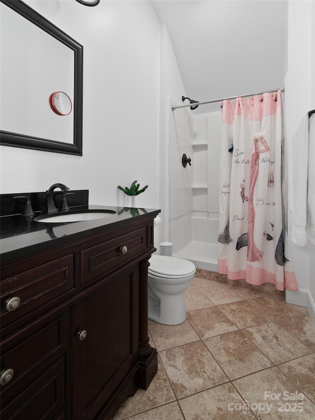 bathroom with toilet, vanity, vaulted ceiling, and walk in shower