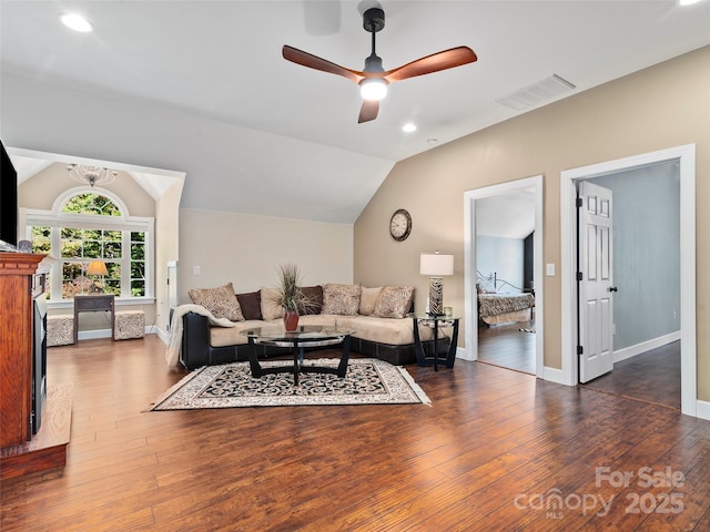 living room with ceiling fan, dark wood-type flooring, and lofted ceiling