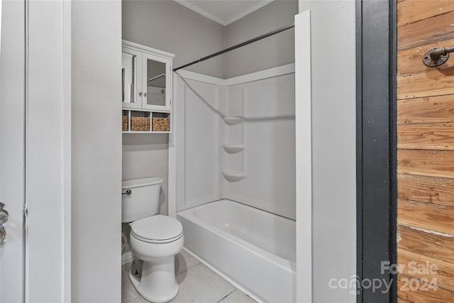 bathroom featuring toilet, bathtub / shower combination, and tile patterned floors