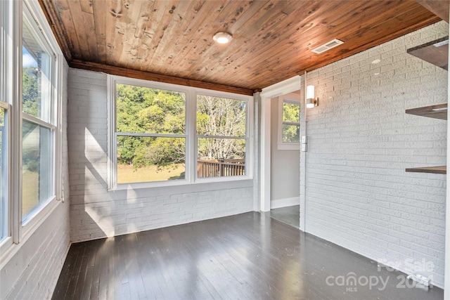 unfurnished sunroom with wood ceiling