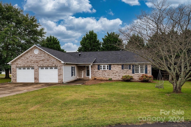 ranch-style house with a front yard and a garage