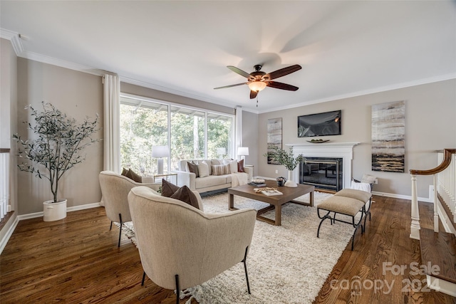 living room featuring ornamental molding, ceiling fan, and dark hardwood / wood-style flooring