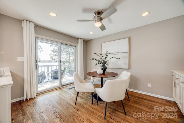 dining room with wood-type flooring and ceiling fan