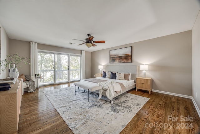 bedroom featuring ceiling fan, access to outside, and dark hardwood / wood-style floors