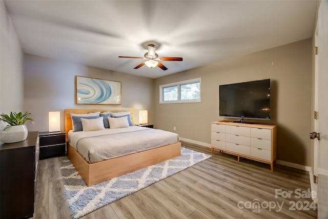 bedroom featuring hardwood / wood-style floors and ceiling fan