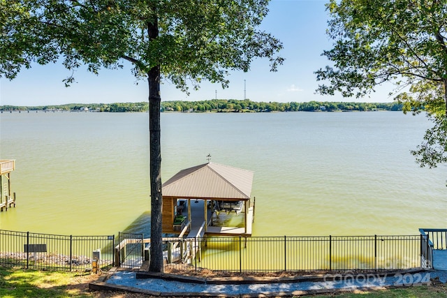 view of dock featuring a gazebo and a water view