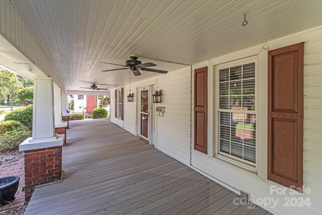 wooden deck with ceiling fan and covered porch