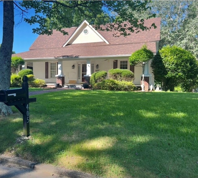 405 7th St, Spencer, NC 28159 - view of front facade featuring a front lawn and roof with shingles