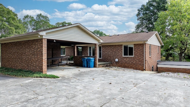 back of house with a patio