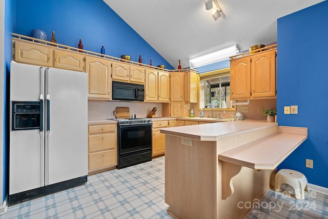 kitchen with kitchen peninsula, black appliances, a kitchen bar, light brown cabinetry, and a textured ceiling