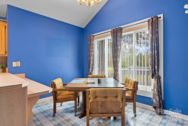 dining room featuring vaulted ceiling