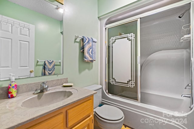 full bathroom with vanity, toilet, a textured ceiling, and bath / shower combo with glass door