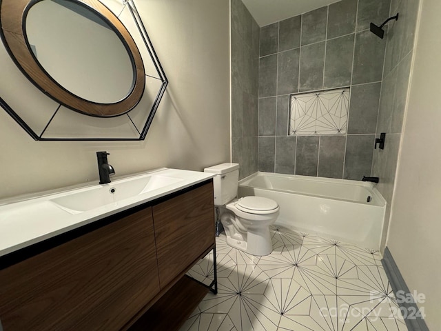 full bathroom with tile patterned floors, tiled shower / bath combo, vanity, and toilet