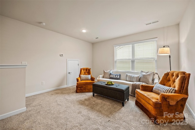 carpeted living area featuring visible vents, recessed lighting, and baseboards