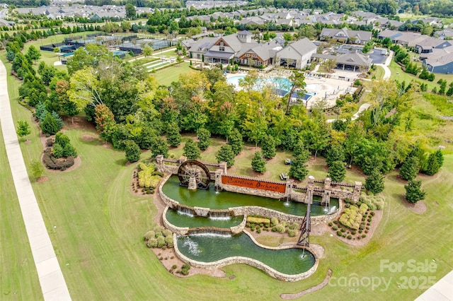 birds eye view of property featuring a residential view and a water view