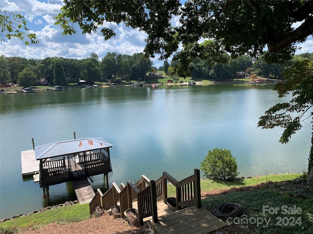 dock area with a water view