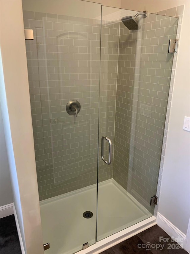 bathroom with an enclosed shower