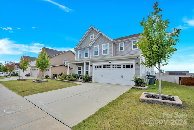 view of front facade with a front yard and a garage