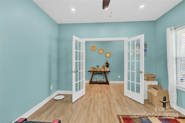 game room featuring light hardwood / wood-style floors, ceiling fan, and french doors