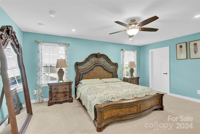 carpeted bedroom featuring ceiling fan