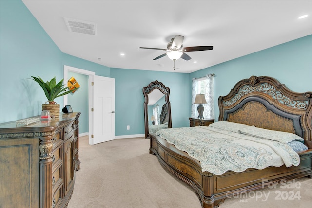 bedroom with ceiling fan and light colored carpet