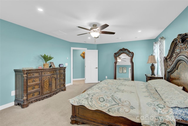 bedroom with ceiling fan and light colored carpet