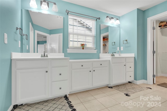 bathroom with vanity and tile patterned floors