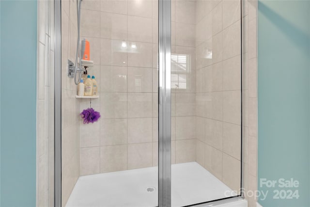 bathroom featuring an enclosed shower