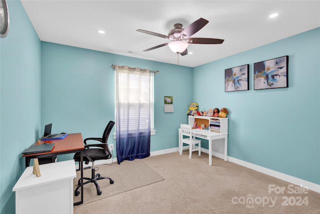 office featuring light carpet and ceiling fan