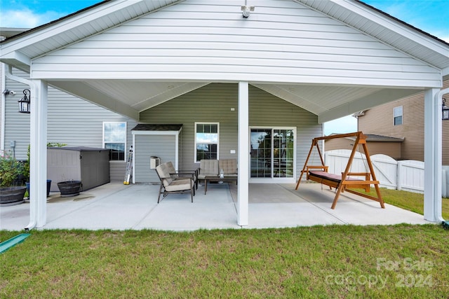 rear view of property with a lawn, a patio, and a gazebo