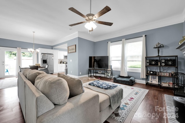 living room featuring ornamental molding, plenty of natural light, and dark hardwood / wood-style flooring