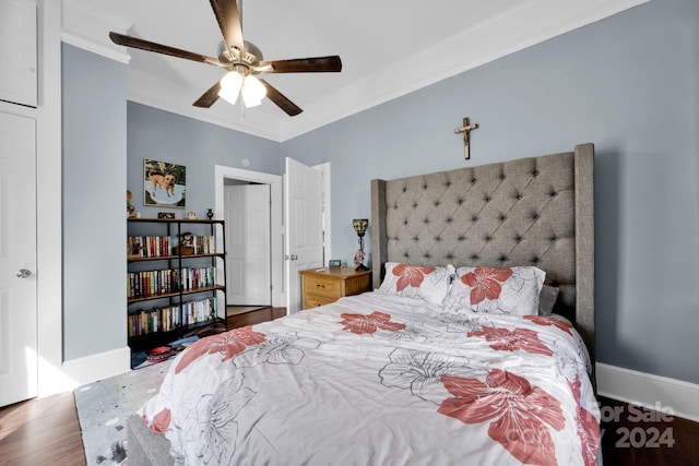 bedroom with crown molding, ceiling fan, and dark hardwood / wood-style floors