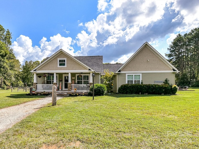 view of front of home featuring a front lawn and covered porch