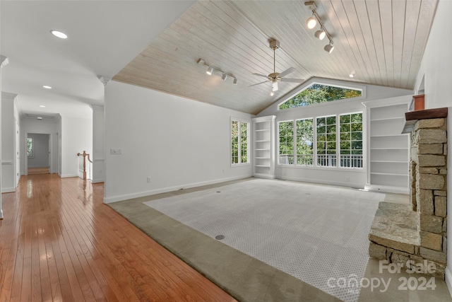 unfurnished living room with ceiling fan, wood ceiling, light hardwood / wood-style floors, and rail lighting