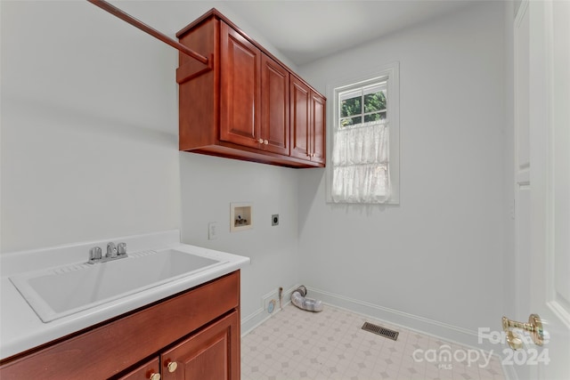 laundry room featuring cabinets, hookup for an electric dryer, washer hookup, and sink