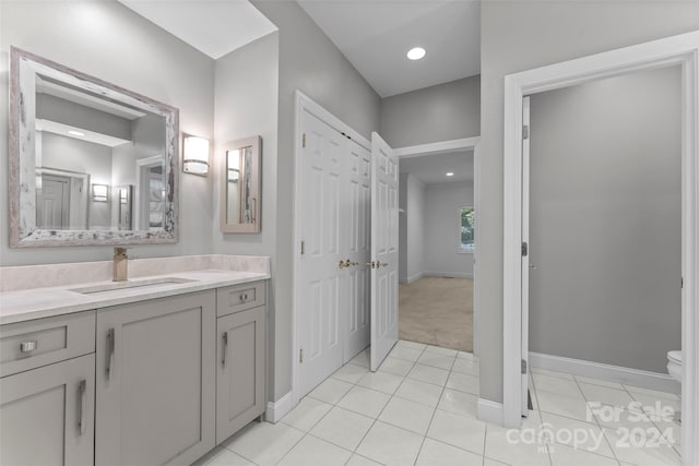 bathroom featuring vanity, toilet, and tile patterned floors